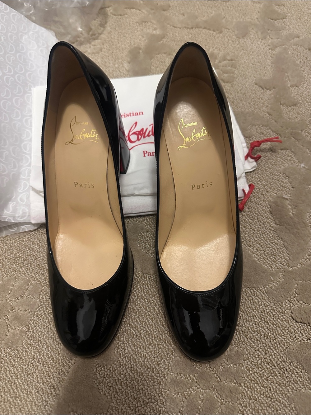 Christian Louboutin black patent heels - worn once inside .